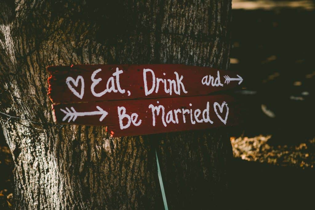photo of a sign that says "eat, drink and be married"