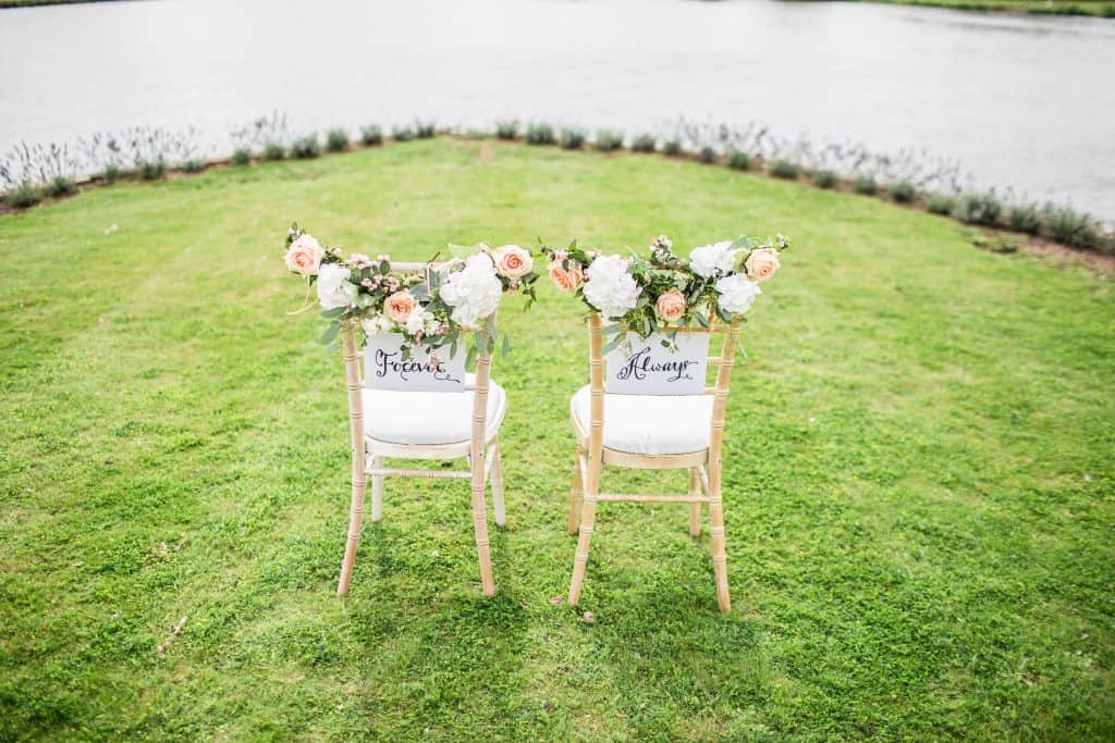 two wedding chairs that say "forever" and "always"