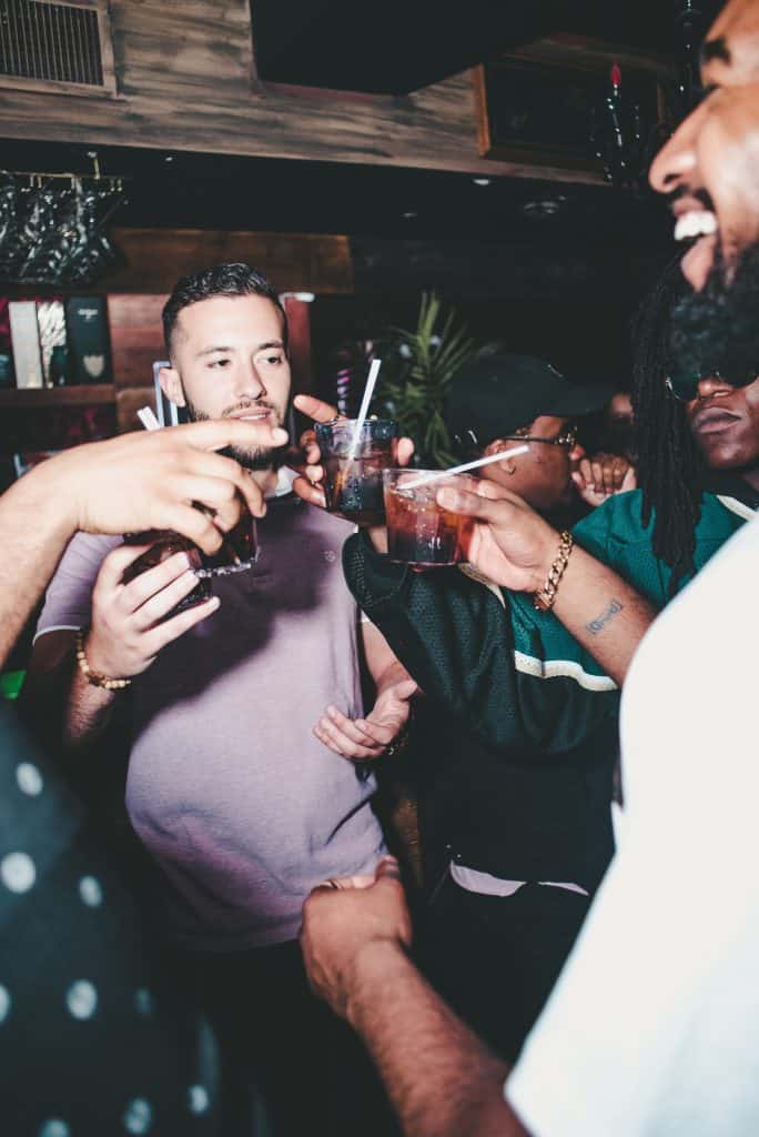 a photo of a group of men partying 