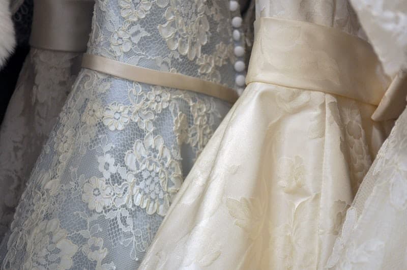 photo of several wedding dresses up close