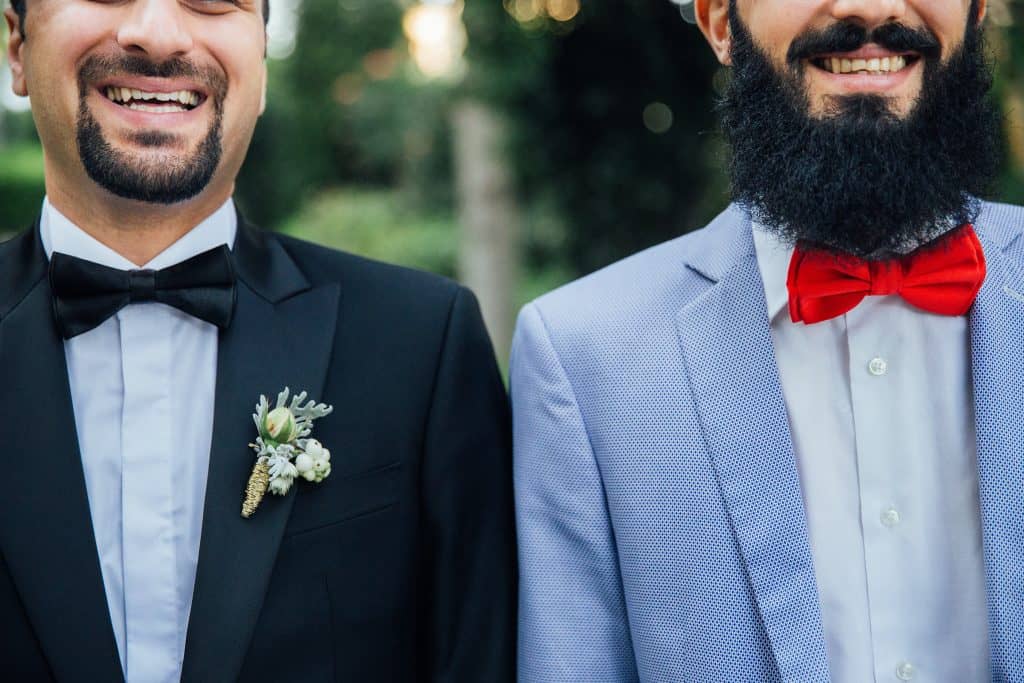 picture of two men smiling getting married