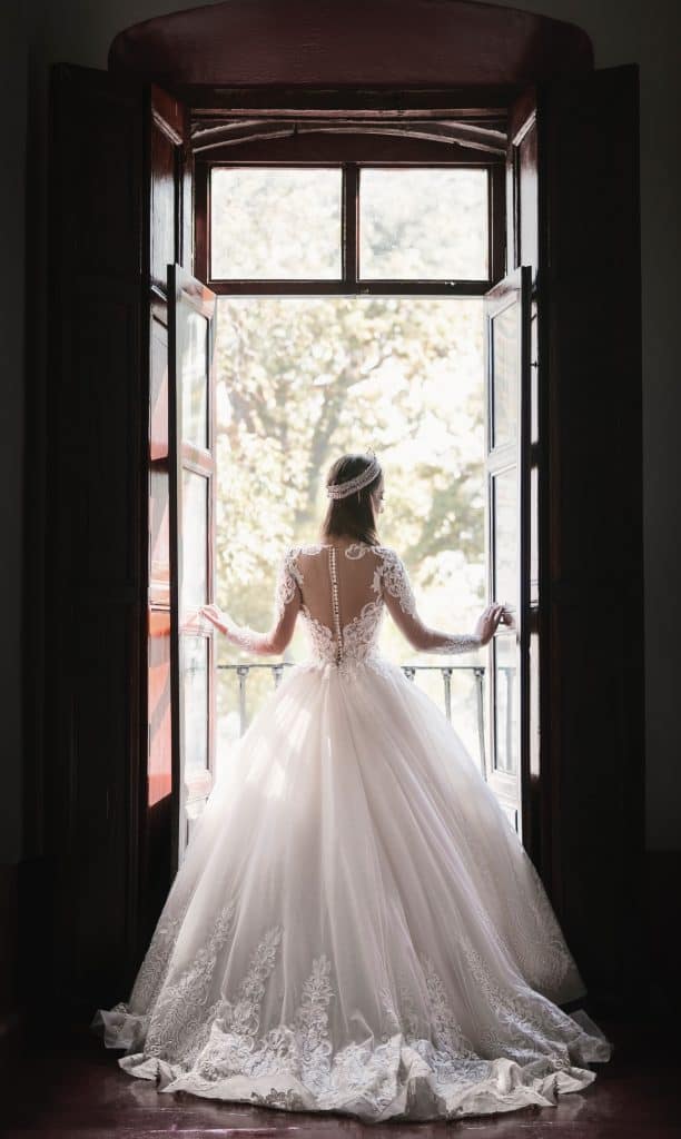 a woman in a wedding dress from behind