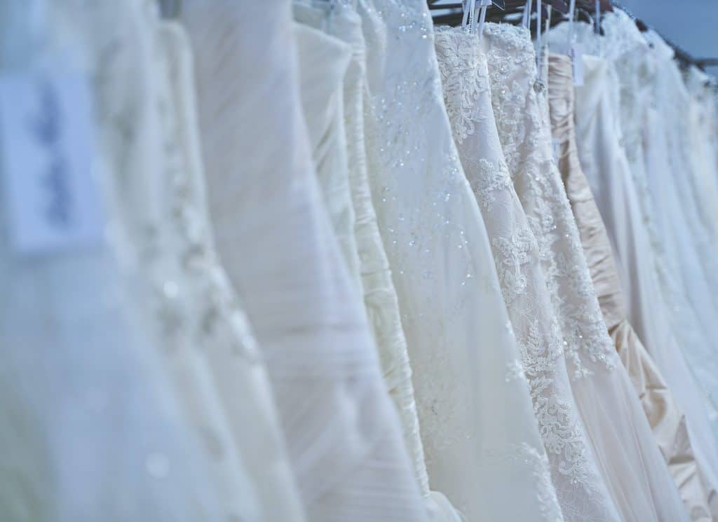 a rack of wedding gowns