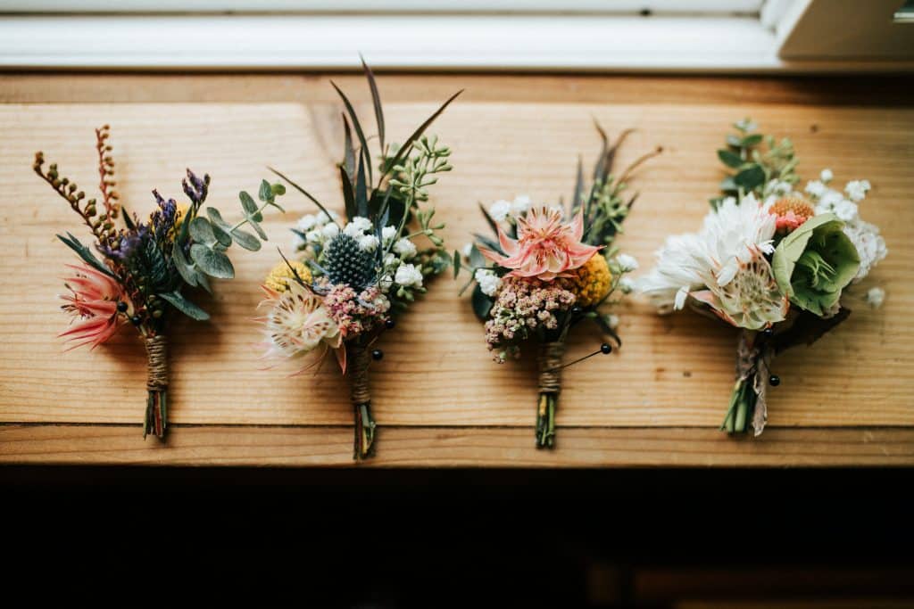 picture of four wedding bouquets on a window sill