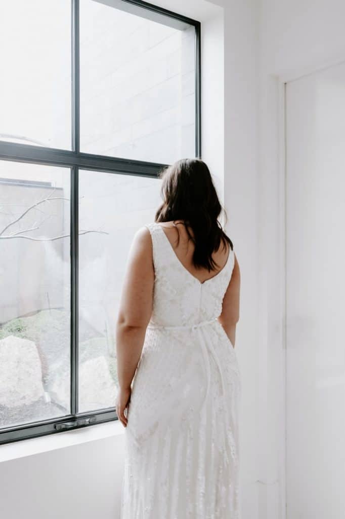 the back of a bride staring out the window