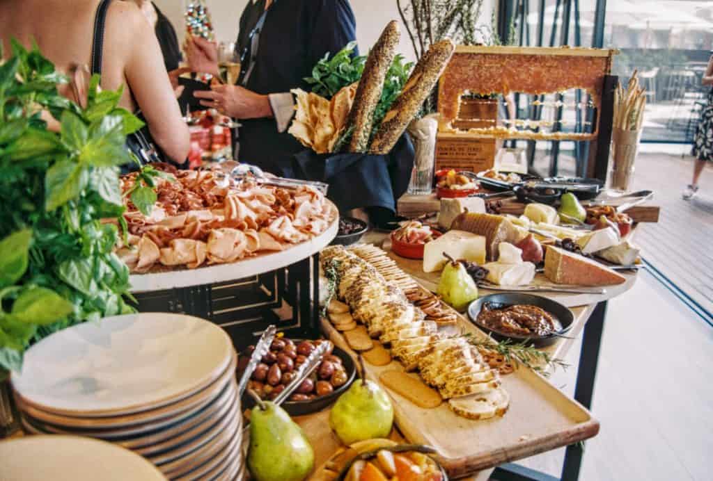 a buffet of charcuterie, cheese and fruit