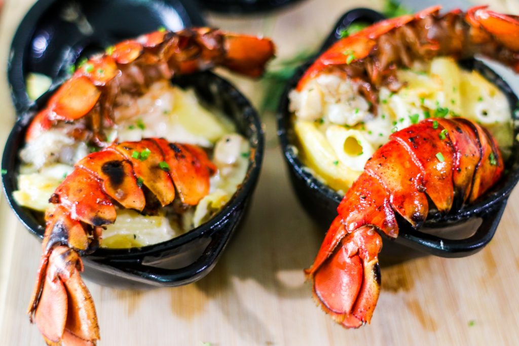 photo of lobster tails in soup pots