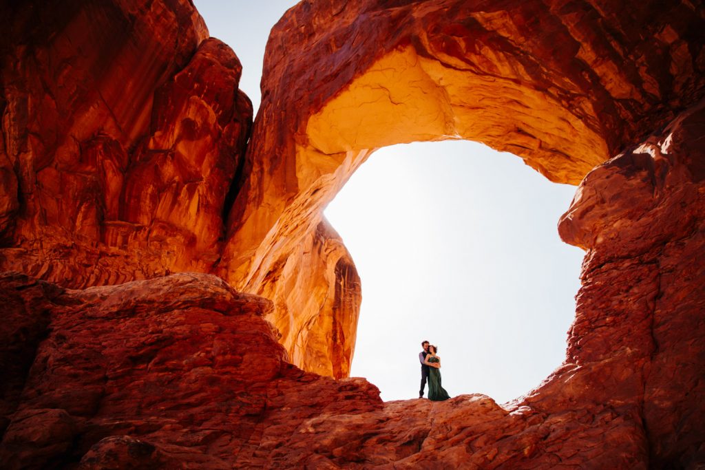 photo of an engaged couple in a desert