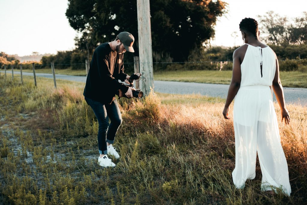 videographer filming a black bride