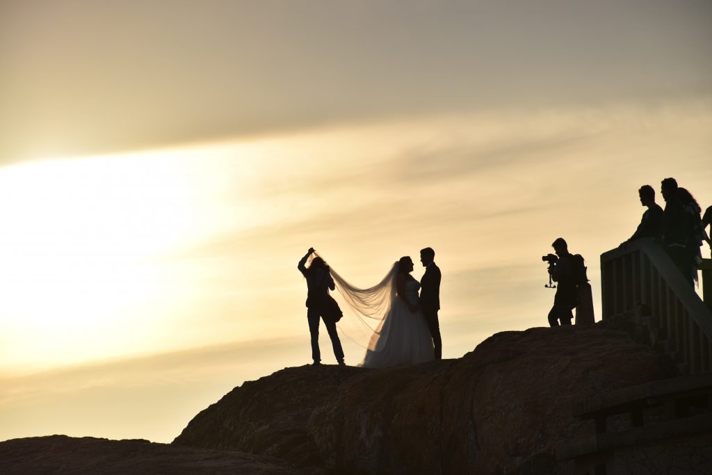 video shoot of a wedding at sunset on a mountain