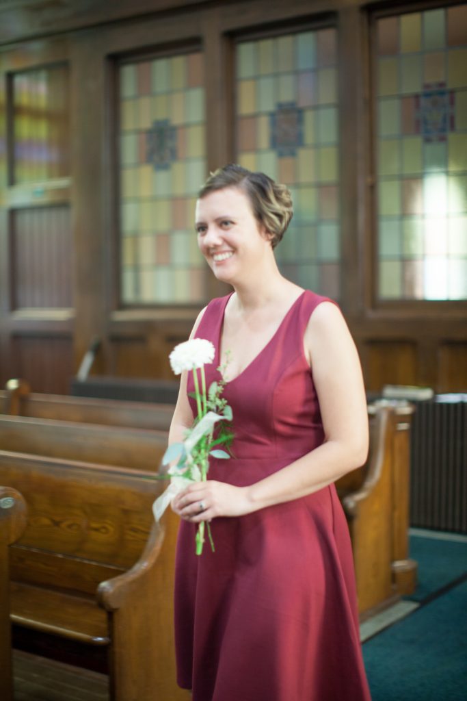 bridesmaid with one flower