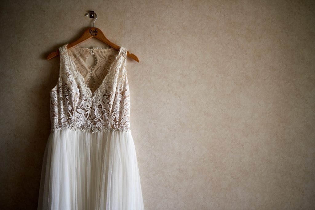 wedding gown on a hanger