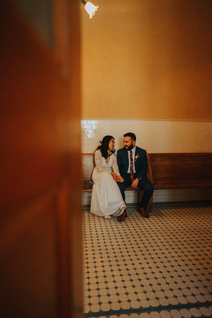 bride and groom waiting in a courthouse to get married