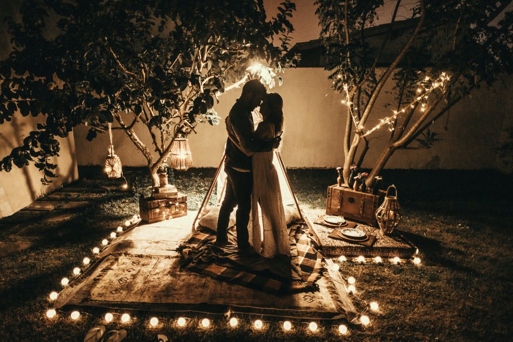 bride and groom with an intimate backyard evening wedding set up