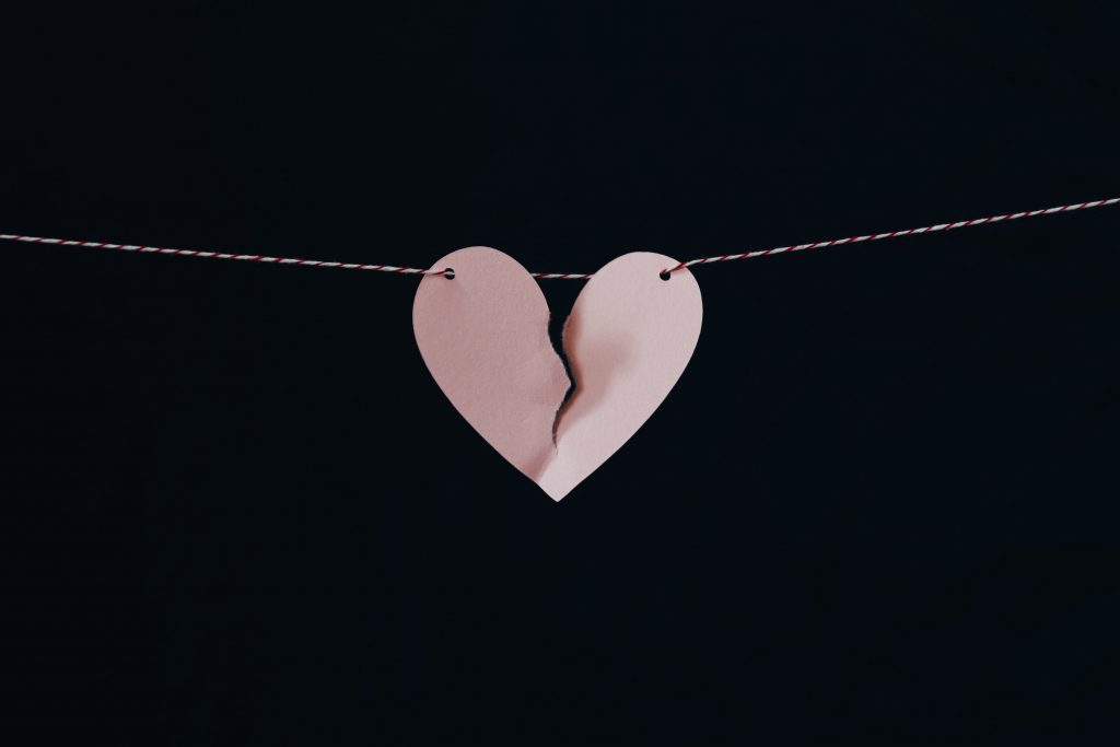 broken paper heart on a string