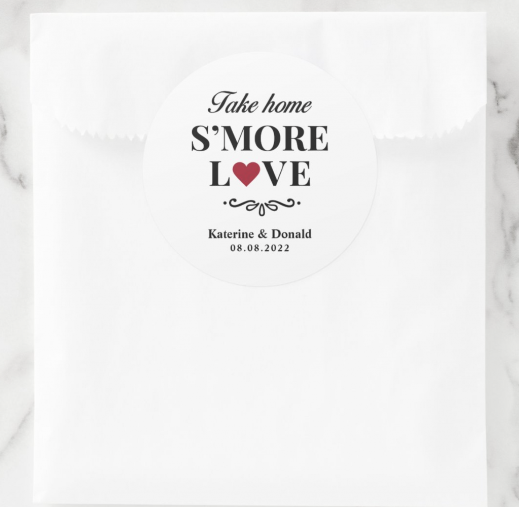 white bag with a "take home s'more love" sticker on it on a marble background