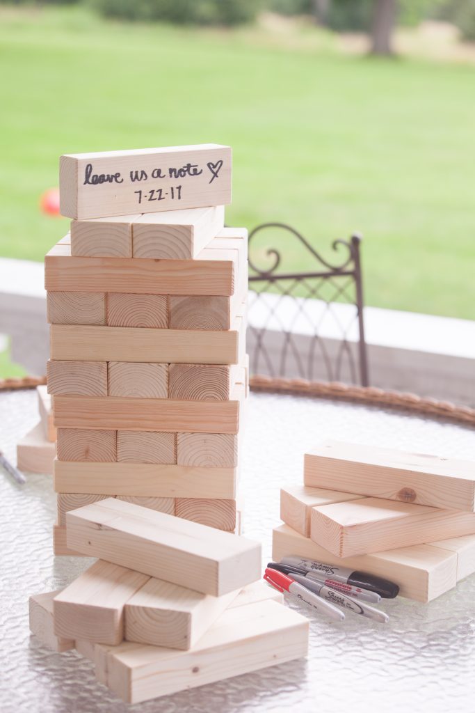 stack of jenga blocks that says "leave us a note"