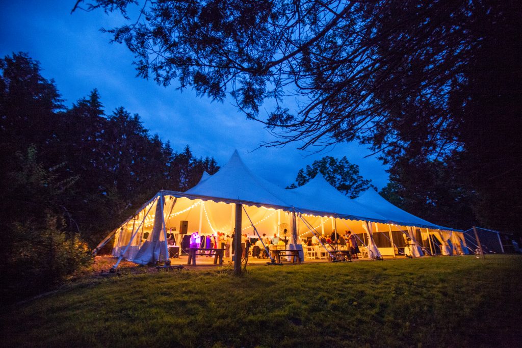 wedding tent lit up at night