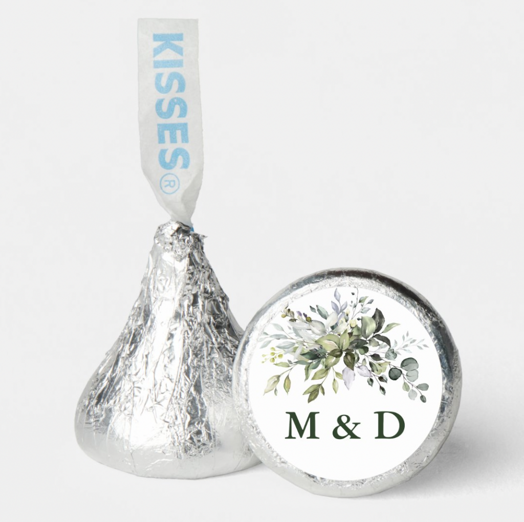 hershey kiss with sticker on the bottom that says "M&D"