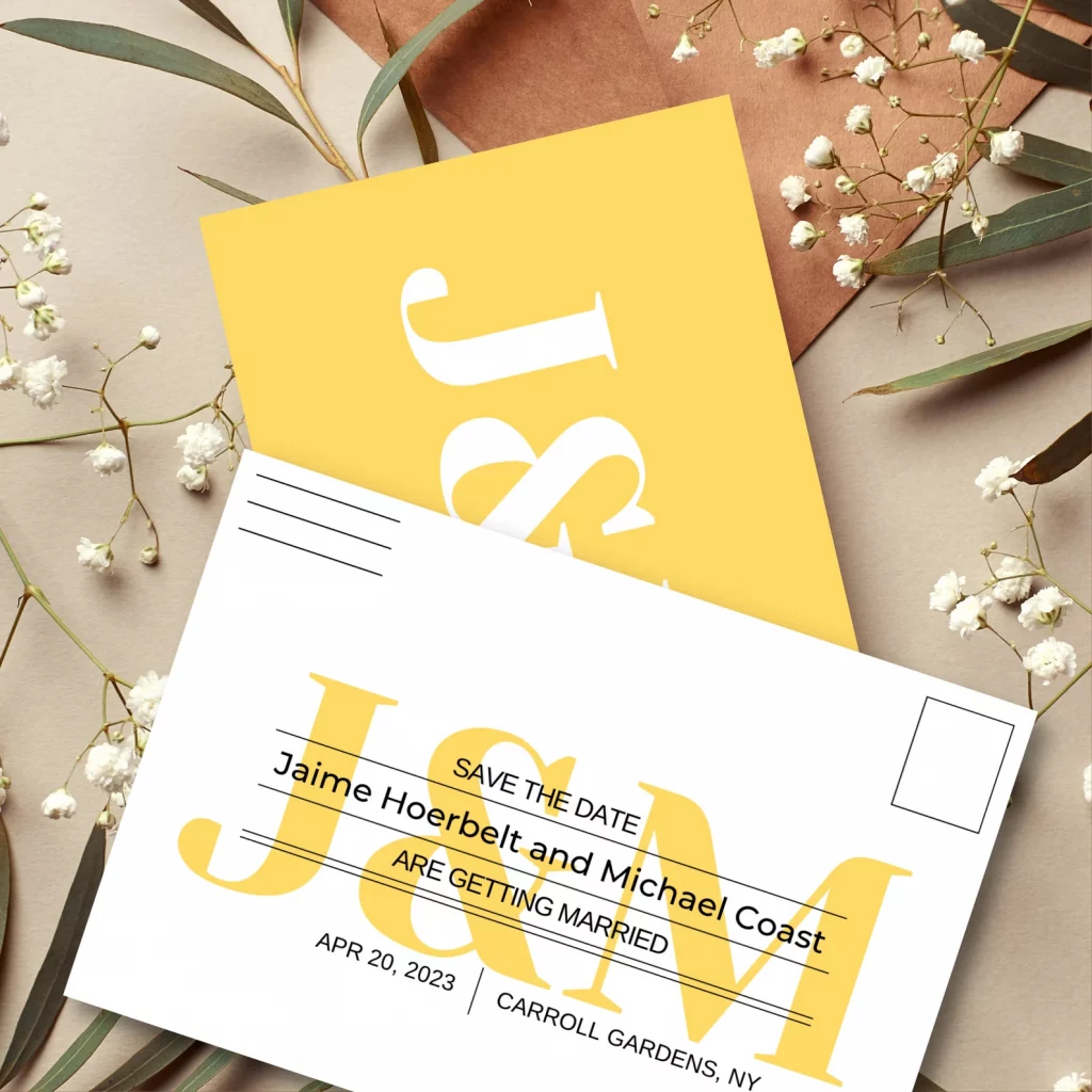 bright yellow save the date post card on a taupe background with white flowers